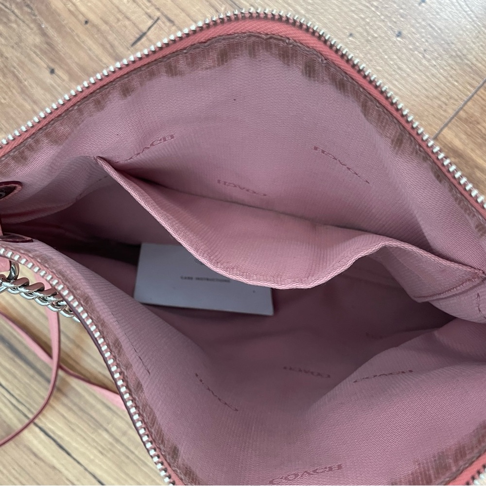 Gently used blush pink leather Coach crossbody bag with silver chain. - Picture 3 of 5